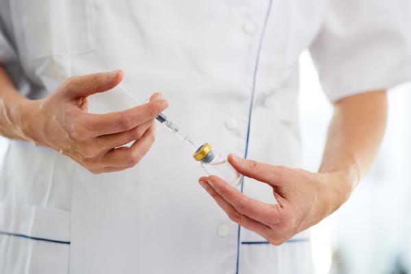 Symbolic - Researchers and vaccine vials